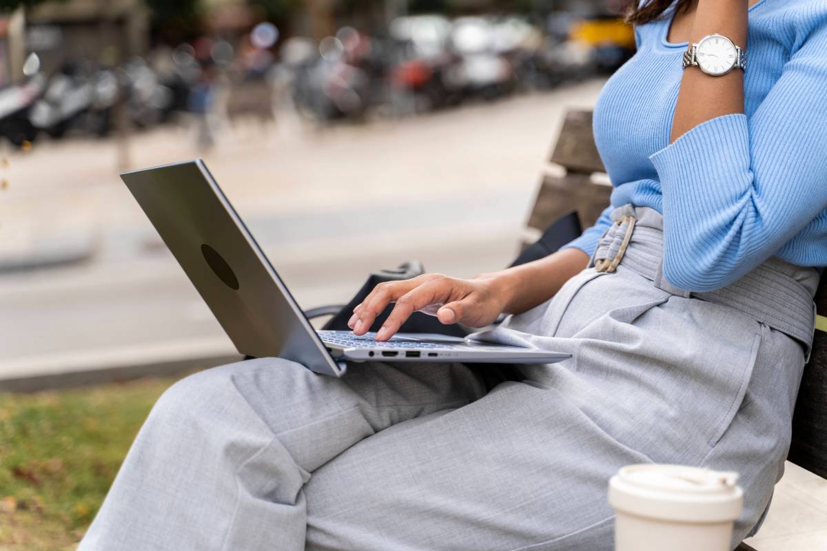 Woman checking emails on laptop