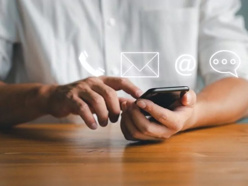 Person typing on smartphone for digital legal first aid consultation.