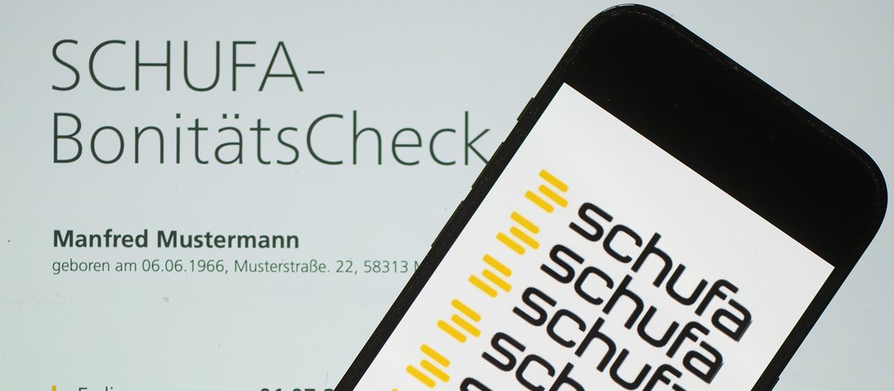 Smartphone with Schufa logo on screen