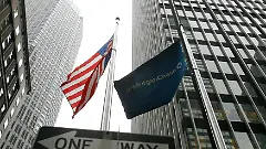 A J.P. Morgan Chase flag flying near its headquarters in New York, symbolizing the bank's expansion into German savings accounts