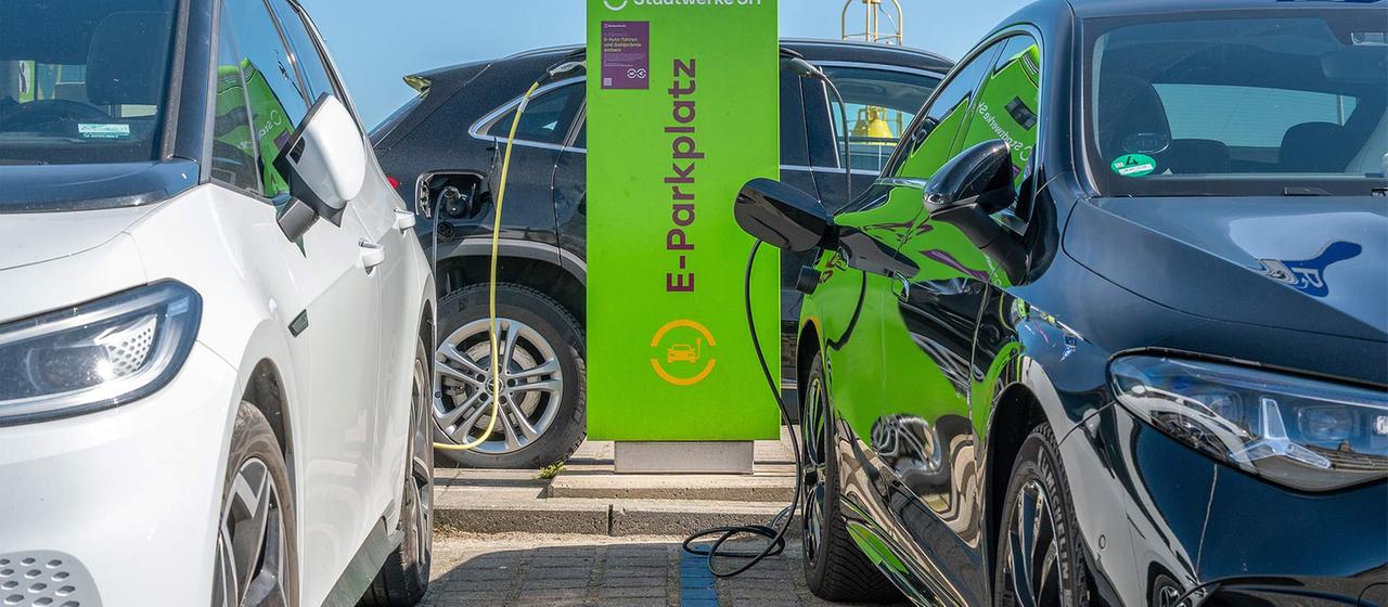 Electric vehicles charging at a station in Germany